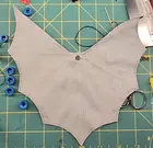Cape (black and gray, triangular)